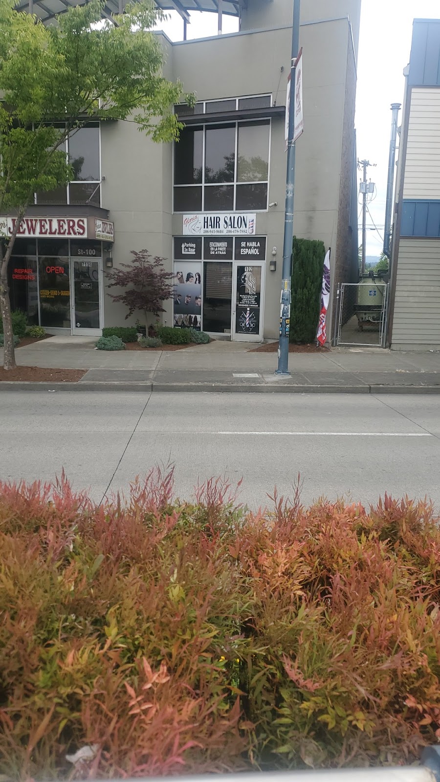 Gloria Hair Salon storefront sign on Martin Luther King Jr Way S, Rainier Valley, Seattle &mdash; bilingual Se Habla Español sign in window